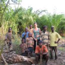 Tourists with palm wine brewers